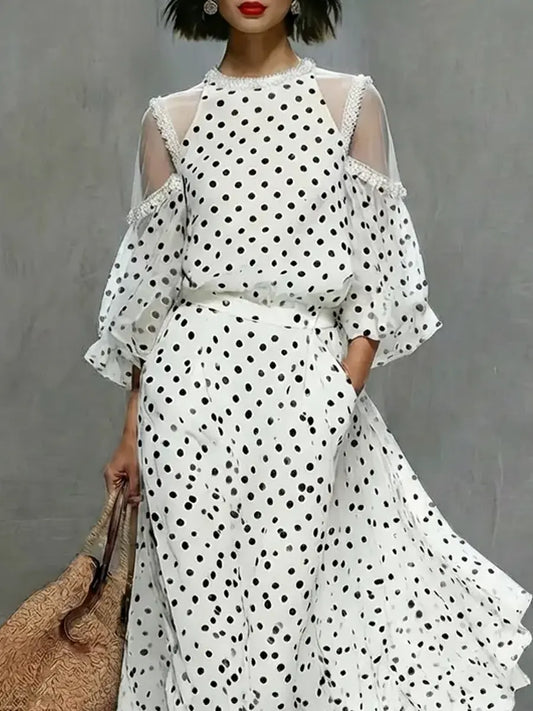 Valeria | Vestido largo fluido con estampado de lunares y hombros abiertos